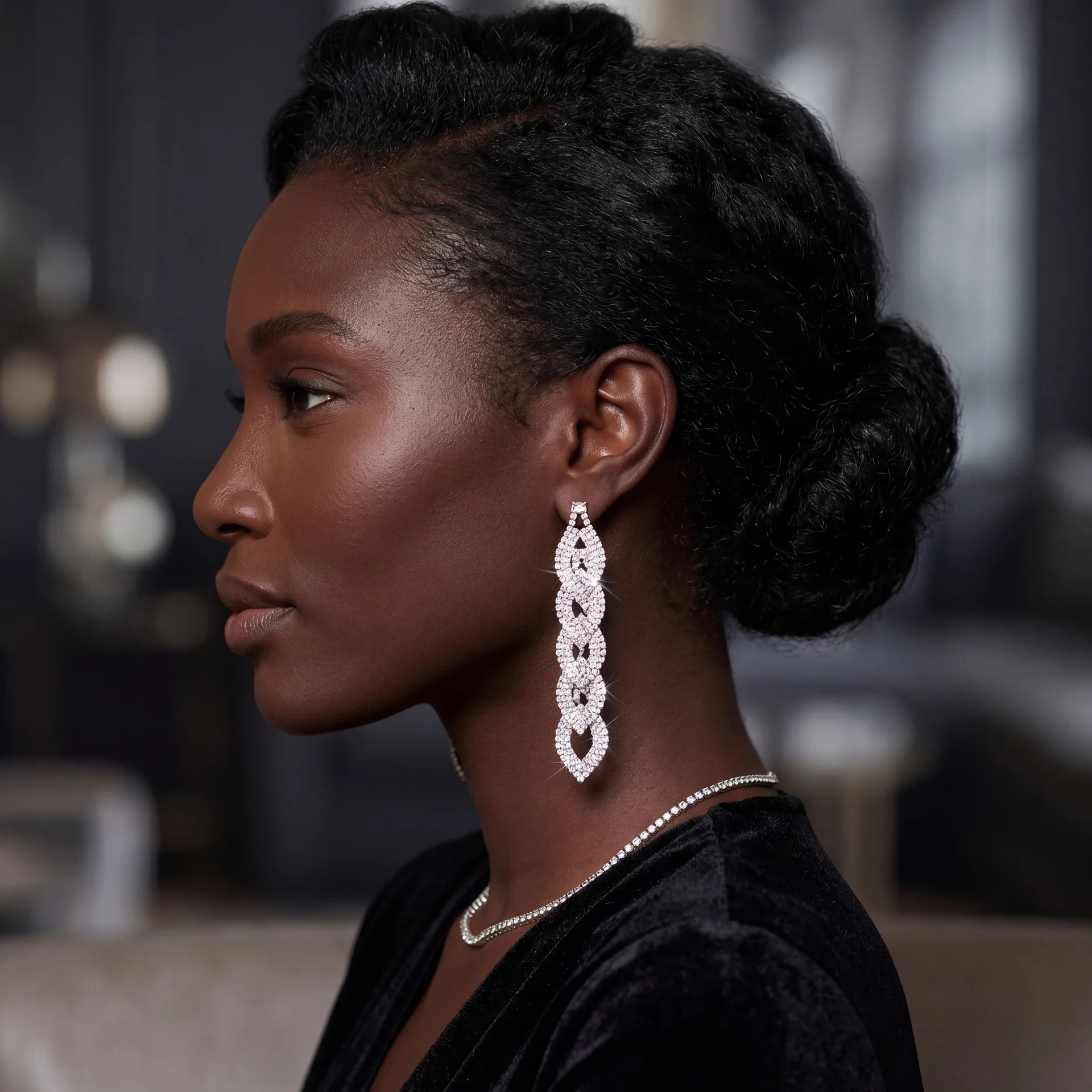 Long silver rhinestone pavé interlocking link drop earrings on kraft card display — DubyAllure Lumière Cascade